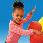 discovery center toddler play systems girl playing with the bongo drums