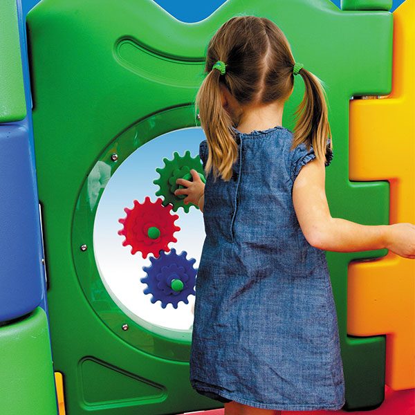 discovery center toddler play systems girl playing with the gear panel