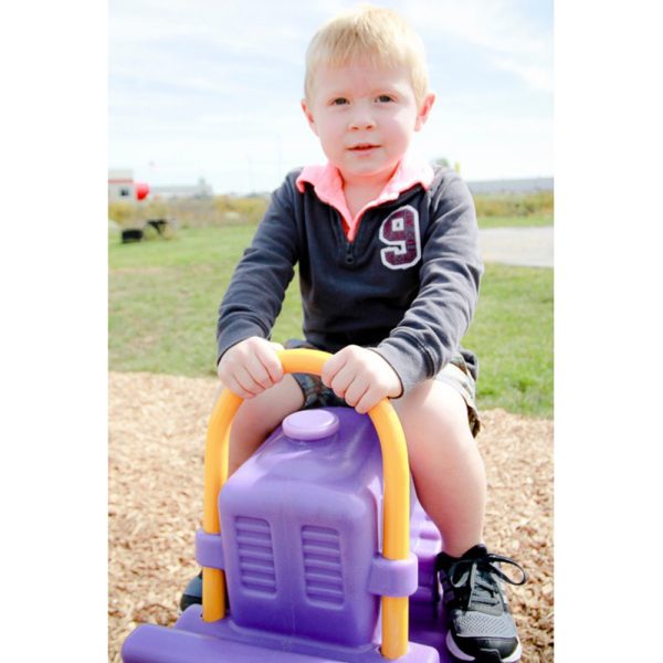 Kid on Benny Bulldozer Spring Rider